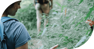 Woman walking in forest