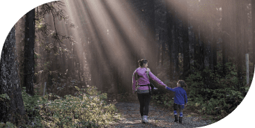 Woman walking in forest